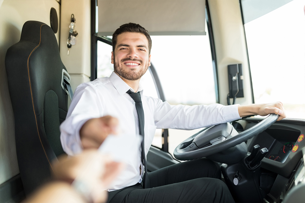 Driver assisting customer after ridership reaches pre-pandemic levels