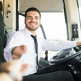 Driver assisting customer after ridership reaches pre-pandemic levels